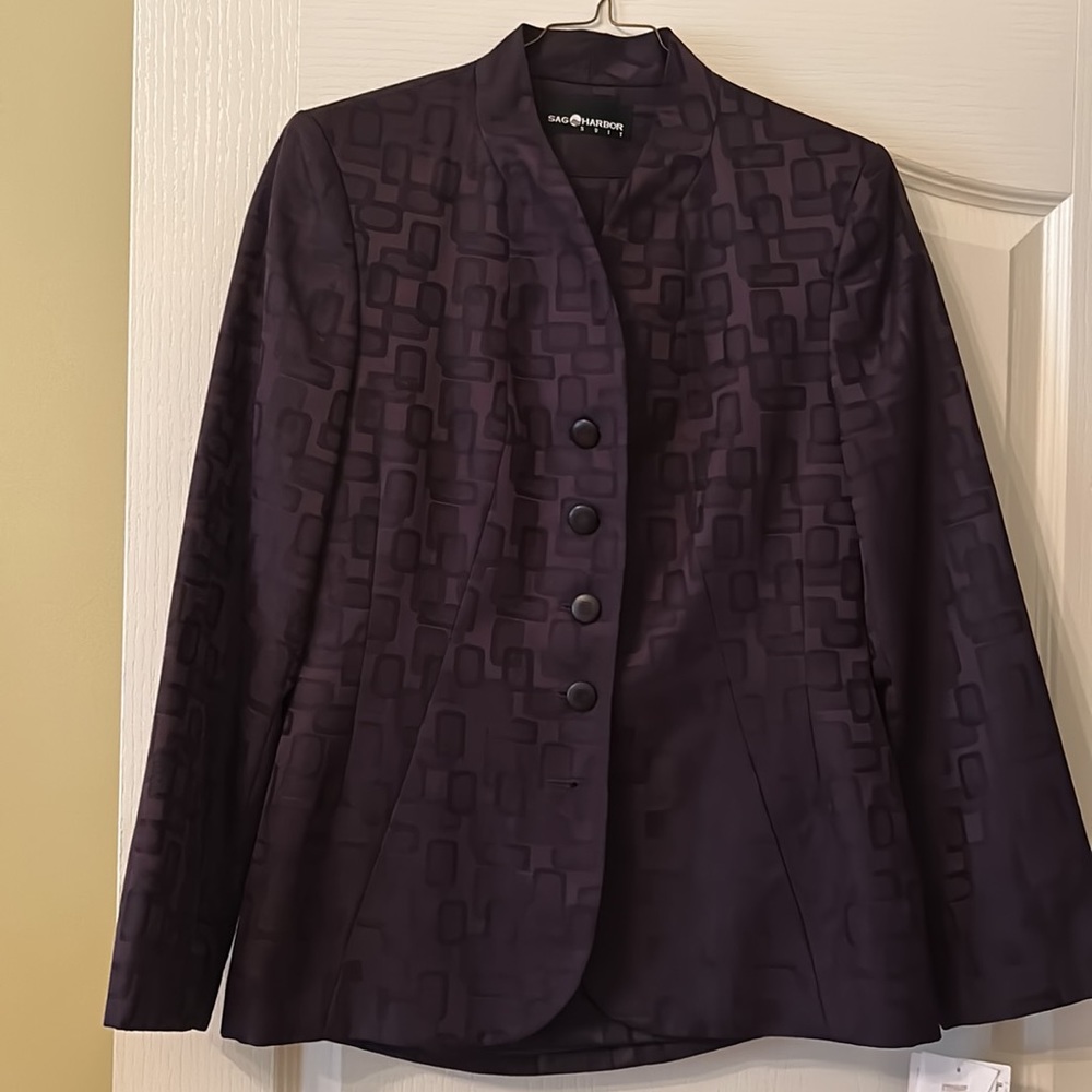 Suit by Sag Harbor.  Size 10 and has a sexy slit on the left side.  NWT